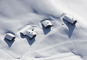 An aerial view shows a small village in the Swiss Alps An aerial view shows a small village in the Swiss Alps