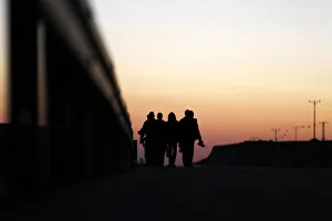 African migrants walk on a road after choosing to permanently leave their open detention African migrants walk on a road after choosing to permanently leave their open detention