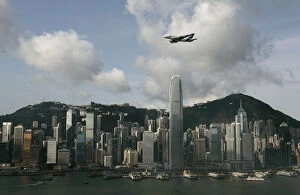 Images Dated 3rd September 2007: An Airbus A380 flies over Hong Kongs Victoria Harbour in Hong Kong