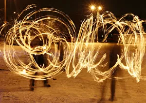 Images Dated 22nd January 2012: Amateur artists perform a fire show to celebrate the Chinese Lunar New Year in Russia s