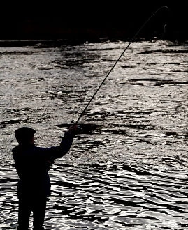 Images Dated 15th January 2018: An angler casts his line on the opening day of the salmon fishing season on the River Tay