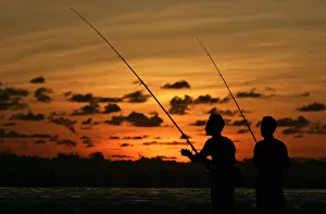 Anglers fish off Legian beach on the Indonesian resort island of Bali Anglers fish off Legian beach on the Indonesian resort island of Bali