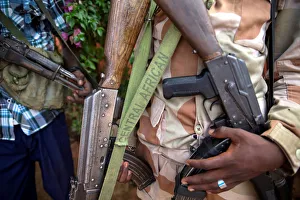 An armed fighter belonging to the 3R armed militia displays his weapon in the town of An armed fighter belonging to the 3R armed militia displays his weapon in the town of