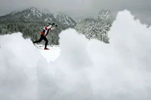 An athlete tries to make his way after heavy snow falls at the cross country race track for An athlete tries to make his way after heavy snow falls at the cross country race track for