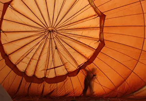 A balloonist checks his balloon before the start of the 14th Philippine International A balloonist checks his balloon before the start of the 14th Philippine International