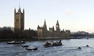 The barge carrying the northern bottle-nosed whale rescued from the river Thames passes The barge carrying the northern bottle-nosed whale rescued from the river Thames passes