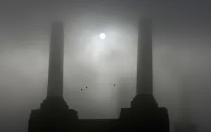 Battersea Power Station is seen shrouded in fog along the river Thames in London Battersea Power Station is seen shrouded in fog along the river Thames in London