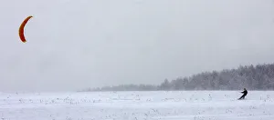 A Belarussian kiteboarder enjoys cold windy weather near the village of Rakov A Belarussian kiteboarder enjoys cold windy weather near the village of Rakov