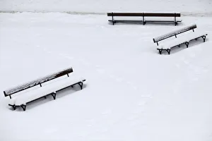 Benches are seen covered by snow at a park in the centre of Warsaw Benches are seen covered by snow at a park in the centre of Warsaw
