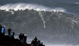 Big-wave surfer Sebastian Steudtner of Germany drops in a large wave at Praia do Norte in Big-wave surfer Sebastian Steudtner of Germany drops in a large wave at Praia do Norte in