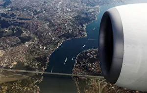 Bosphorus strait and the Fatih Sultan Mehmet bridge are pictured through the window of a Bosphorus strait and the Fatih Sultan Mehmet bridge are pictured through the window of a