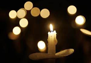 Candle is held at vigil for dead miners in Sago Candle is held at vigil for dead miners in Sago