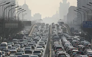 Cars are driven on one of the ring roads in Beijings city centre Cars are driven on one of the ring roads in Beijings city centre