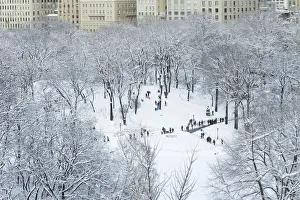 Children sled on a hill inside of Central Park after a snowstorm in New York Children sled on a hill inside of Central Park after a snowstorm in New York