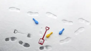 A childs spade and skittles rest in the snow in the seaside village of Ballycastle A childs spade and skittles rest in the snow in the seaside village of Ballycastle