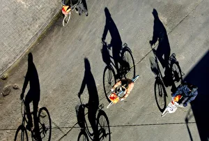 Chinese people ride their bycicles on a sunny autumn day in Beijings city centre Chinese people ride their bycicles on a sunny autumn day in Beijings city centre
