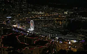 Monaco Collection: Christmas decorations and a Ferris wheel light the port of Monaco during holiday season