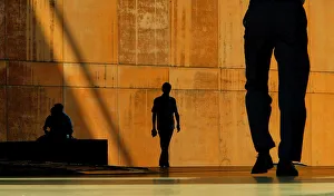 CITY WORKERS ARE SILHOUETTED AGAINST A WALL DURING HEAT WAVE IN LONDON CITY WORKERS ARE SILHOUETTED AGAINST A WALL DURING HEAT WAVE IN LONDON