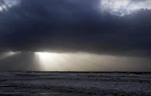 Clouds are pictured as waves break along Frances Atlantic coastline at sunset in Lacanau Clouds are pictured as waves break along Frances Atlantic coastline at sunset in Lacanau