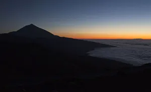 Clouds surround the Teide volcano at sunset in Tenerife Clouds surround the Teide volcano at sunset in Tenerife