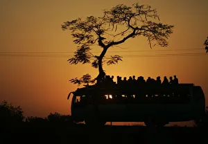 Commuters travel on a bus on a highway near Midnapore town Commuters travel on a bus on a highway near Midnapore town