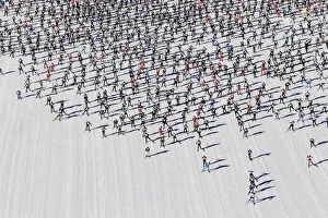Images Dated 10th March 2013: Cross-country skiers start during the Engadin Ski Marathon on the frozen Lake Sils