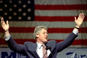 Democratic presidential candidate Bill Clinton raises his arms to supports during Democratic presidential candidate Bill Clinton raises his arms to supports during