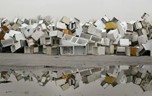 Disused fridges and freezers lie piled up in a storage yard in Manchester Disused fridges and freezers lie piled up in a storage yard in Manchester