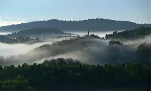 Early autumn morning fog is seen in the valleys near the village of Studencice Early autumn morning fog is seen in the valleys near the village of Studencice
