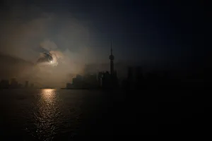 An eclipse is seen at the Bund along the Huangpu River in Shanghai An eclipse is seen at the Bund along the Huangpu River in Shanghai