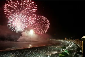 Fireworks explode above Copacabana beach in Rio de Janeiro at midnight Fireworks explode above Copacabana beach in Rio de Janeiro at midnight
