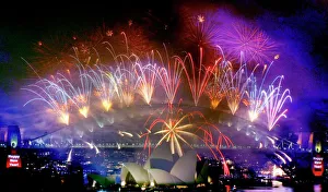 Fireworks explode over the Sydney Harbour Bridge and Opera House Fireworks explode over the Sydney Harbour Bridge and Opera House