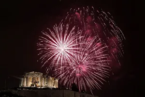 Fireworks explode over the temple of the Parthenon during New Year celebrations in Athens Fireworks explode over the temple of the Parthenon during New Year celebrations in Athens