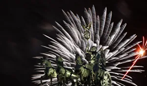 Fireworks illuminate Quadriga sculpture atop Brandenburg Gate in Berlin Fireworks illuminate Quadriga sculpture atop Brandenburg Gate in Berlin