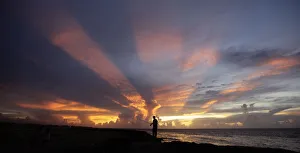 A fisherman casts his line as the sun sets on the outskirts of Havana A fisherman casts his line as the sun sets on the outskirts of Havana