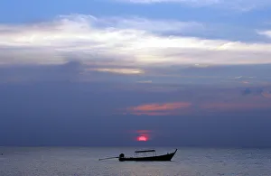 Fishing boat sits anchored in calm waters off coast in Thailands Phang Nga province Fishing boat sits anchored in calm waters off coast in Thailands Phang Nga province