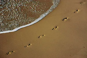Footprints are left on the shore of Sydneys Bronte Beach Footprints are left on the shore of Sydneys Bronte Beach