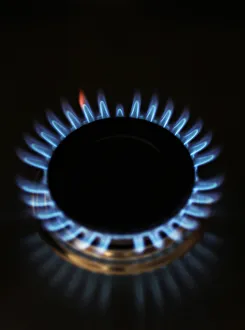 Gas flames are seen burning on a cooker in London Gas flames are seen burning on a cooker in London