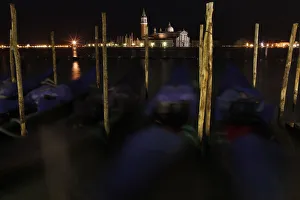 Gondolas are seen along the Canal Grande in front of San Giorgio Maggiore church in Gondolas are seen along the Canal Grande in front of San Giorgio Maggiore church in