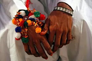 Images Dated 28th January 2018: A groom wears a traditional handmade garland on his wrist