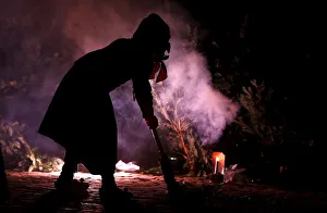 A group of traditional witches (Kandelhexen) dance around a bonfire during their A group of traditional witches (Kandelhexen) dance around a bonfire during their