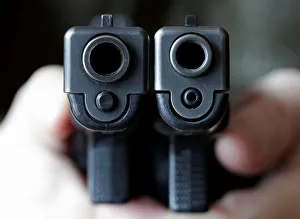 A gun owner displays a Glock 20, 10 mm Auto next to a Glock 19 A gun owner displays a Glock 20, 10 mm Auto next to a Glock 19