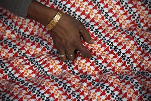 Images Dated 22nd December 2015: A hand of a migrant worker from India is pictured as he makes a blanket from recycled