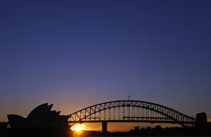 The Harbour Bridge and the Sydney Opera House are seen at sunset in Sydney The Harbour Bridge and the Sydney Opera House are seen at sunset in Sydney