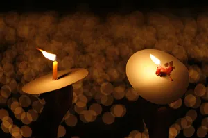 Indonesian Christians hold candles as they pray on Christmas eve at a cathedral in Surabaya Indonesian Christians hold candles as they pray on Christmas eve at a cathedral in Surabaya
