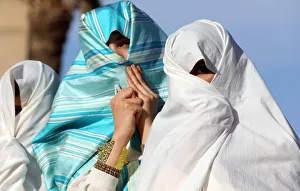 Libyan girls participate in a street festival held to celebrate their traditional Libyan girls participate in a street festival held to celebrate their traditional