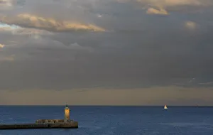 A lighthouse is seen at dusk in a harbour in Valletta A lighthouse is seen at dusk in a harbour in Valletta