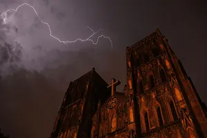 Lighting strikes over Saint Joseph cathedral during a storm in Hanoi Lighting strikes over Saint Joseph cathedral during a storm in Hanoi