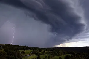 Lightning can be seen as a large storm front crosses over the Sydney suburb of Wakehurst Lightning can be seen as a large storm front crosses over the Sydney suburb of Wakehurst