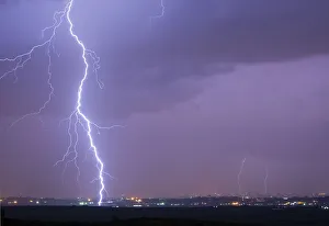 Lightning strikes over Gaza in this general view seen from across the border in southern Lightning strikes over Gaza in this general view seen from across the border in southern